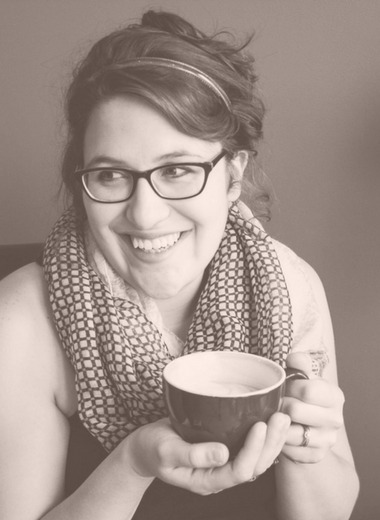 Victoria Wilson holding a cup of coffee.