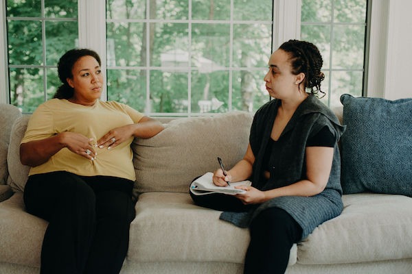 A doula and client talking