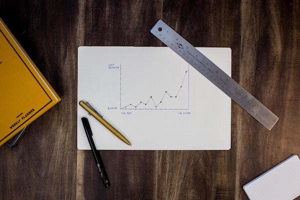 A look at a chart with a ruler.