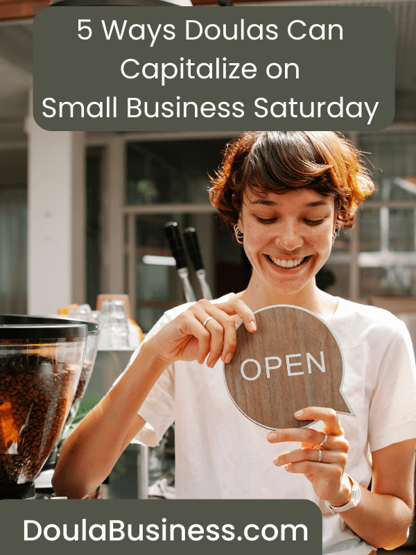 A woman holding up a sign that says welcome to open, embracing the concept of Small Business Saturday.